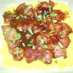 Pork medallions over yellow rice