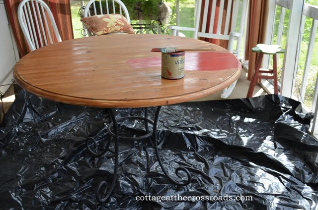 Painting the table on the front porch