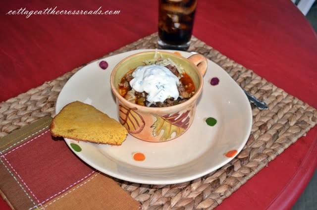 Minted sour cream as a garnish on chili