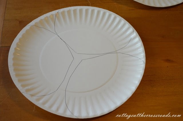 Heads traced on a paper plate