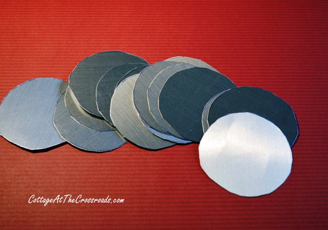 Circles cut out of metallic scrapbook paper