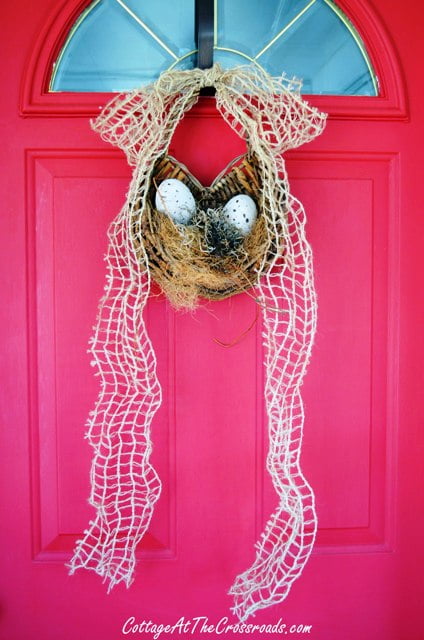 Easter door decoration with natural colored eggs