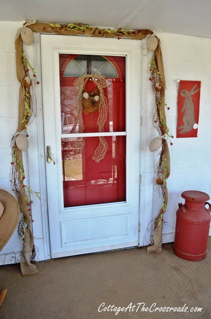 Painted egg garland on the porch