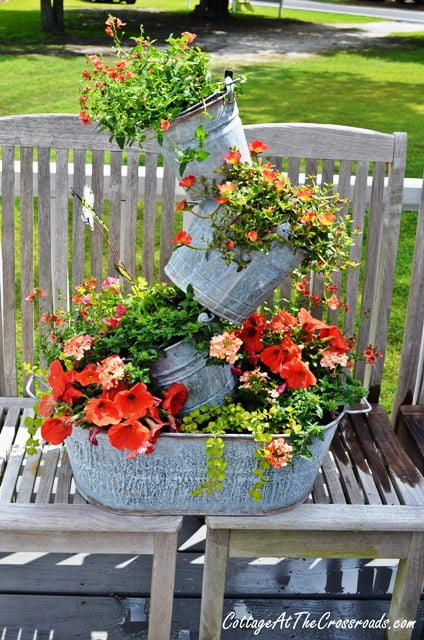 15 Amazing Flower Tower DIY Ideas- These DIY flower towers and tipsy pot planters are stunning ways to add vertical interest to your garden, porch, or front entry! | #tipsyPot #flowerTower #DIY #gardening #ACultivatedNest