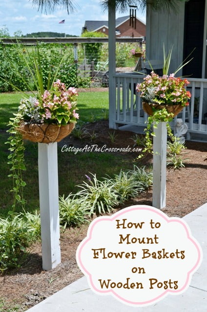 Flower baskets on wooden posts