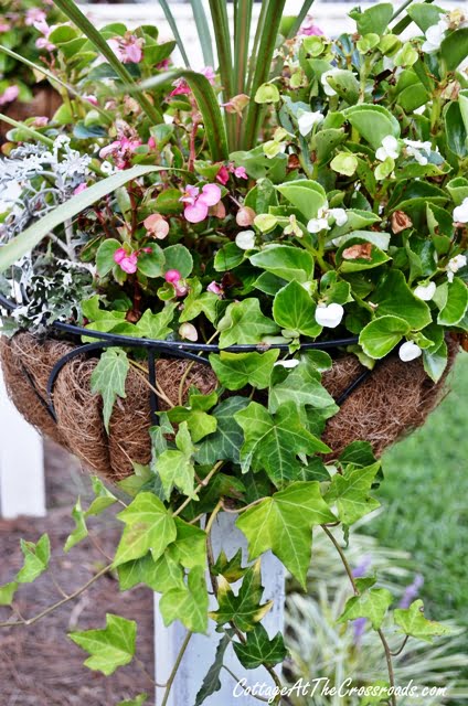 Flower baskets on wooden posts