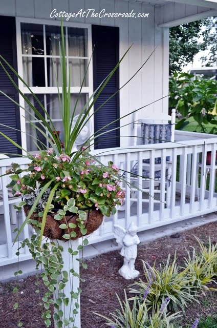 Flower baskets on wooden posts