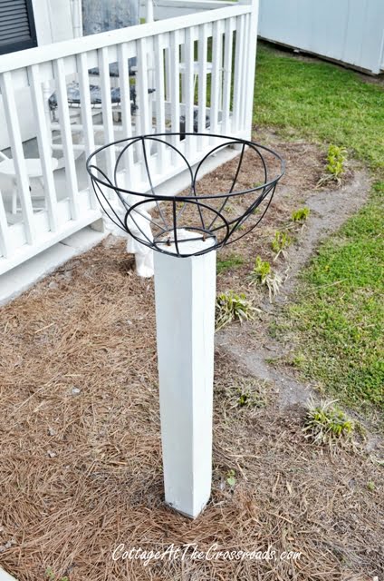 Flower baskets on wooden posts