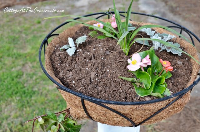 Flower baskets on wooden posts