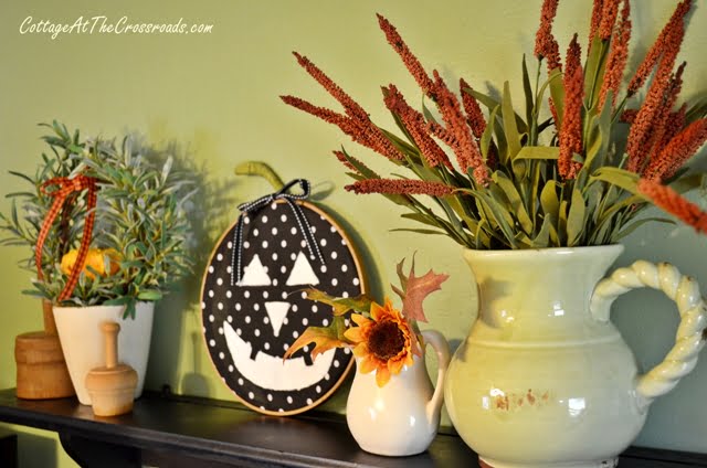 Kitchen shelf decorated for fall