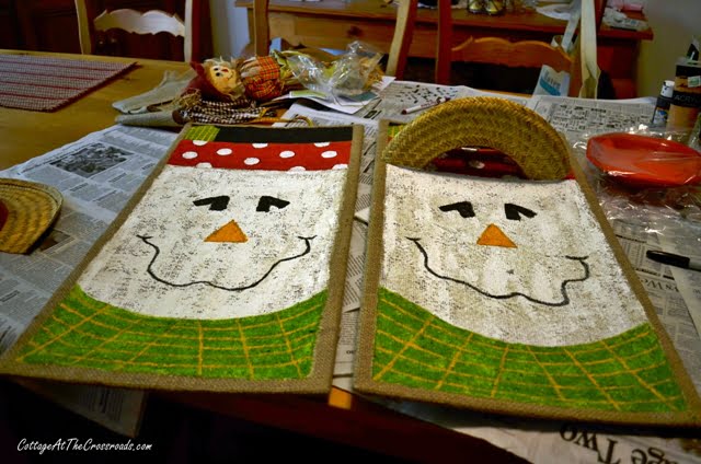 Painted scarecrows on burlap