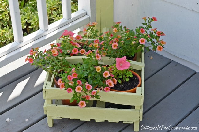 Flowers in a wooden berry box | cottage at the crossroads