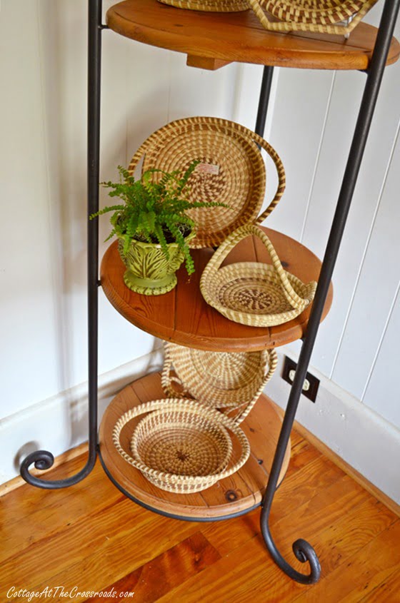 Sweetgrass baskets displayed on a iron and pine corner piece | cottage at the crossroads