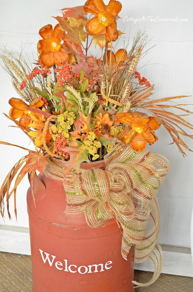 Old milk can dressed for autumn | cottage at the crossroads