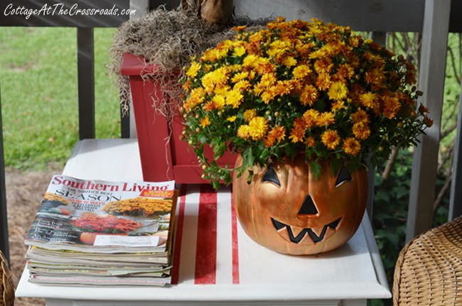 Painted jack-o'-lantern | cottage at the crossroads