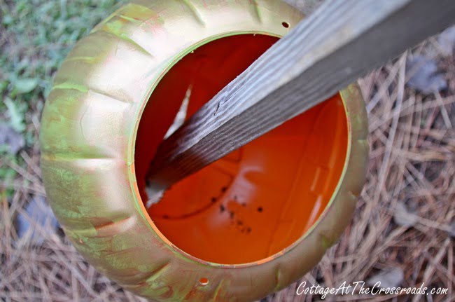 Topsy turvy jack-o' lanterns made from plastic trick-or-treating pails
