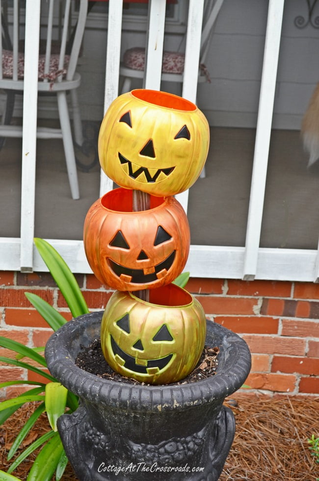 Topsy turvy jack-o' lanterns made from cheap, plastic trick-or-treating pails