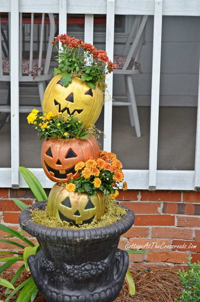 Topsy turvy jack-o' lanterns made from cheap, plastic trick-or-treating pails