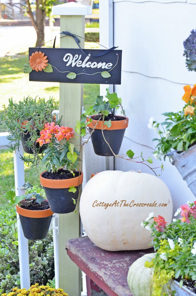 Plant stand with hanging terracotta pots | cottage at the crossroads