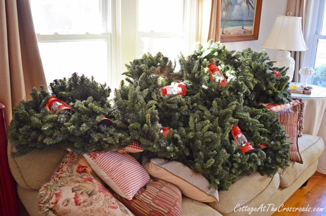 Outdoor wreaths on sofa | cottage at the crossroads