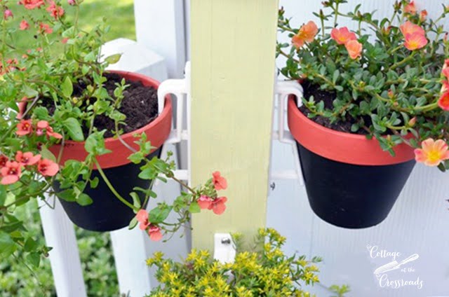 Flower pots hung with terracotta pot holders | cottage at the crossroads