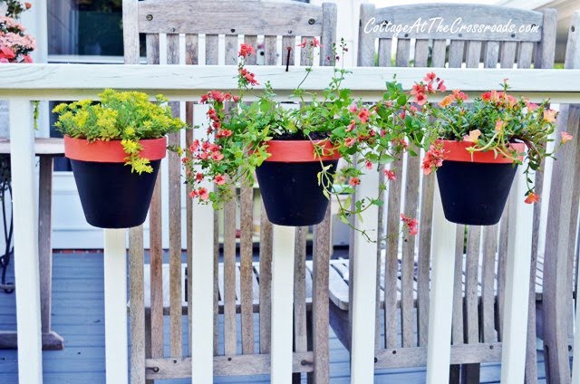 Flower pots hung with terracotta pot holders | cottage at the crossroads