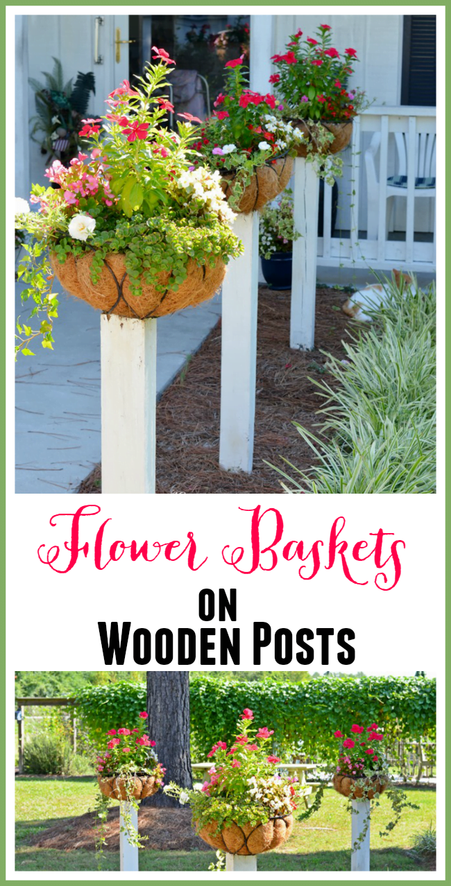 Flower baskets mounted on wooden posts | cottage at the crossroads