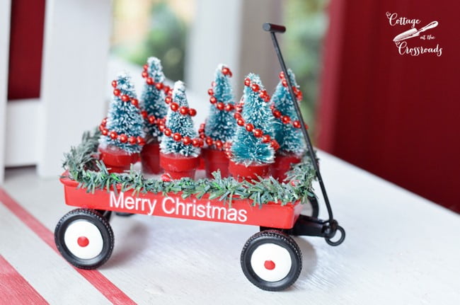 Red wagon filled with christmas trees