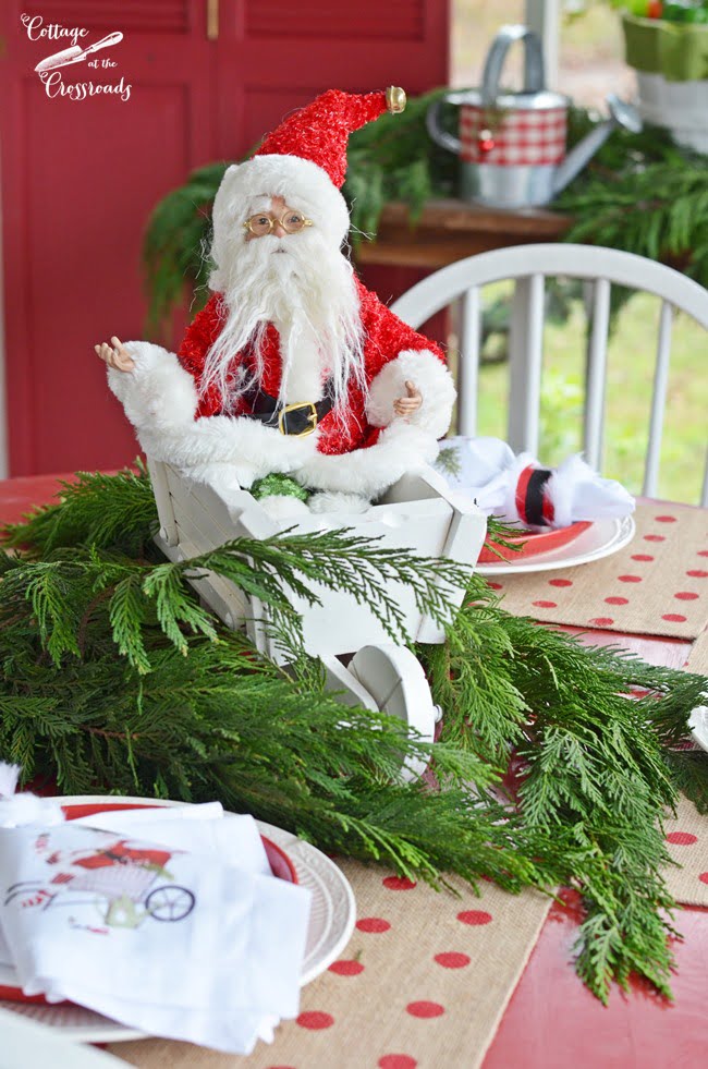 Santa riding in on awheelbarrow