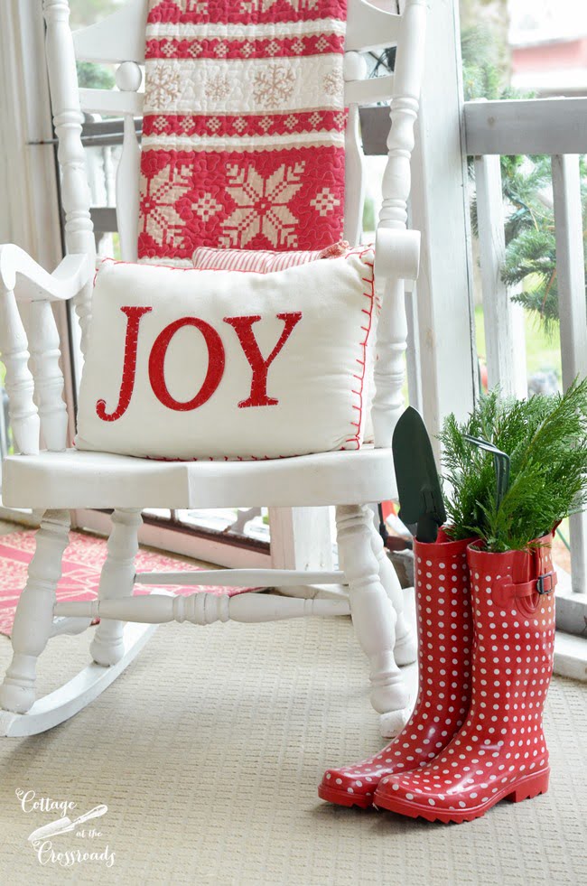 Red gardening boots with christmas pillow