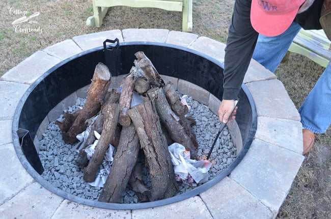 Lighting the first fire in our new belgard fire pit | cottage at the crossroads