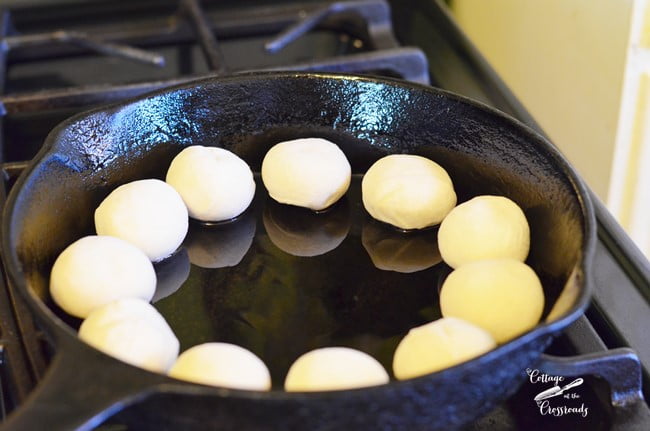 Frozen dinner rolls in a skillet