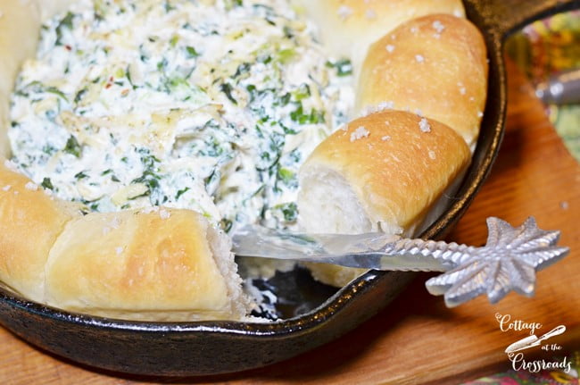 Warm turnip dip with a bread ring cooked and served in a skillet | cottage at the crossroads