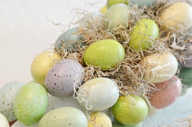 Adding spanish moss to an easter egg topiary | cottage at the crossroads