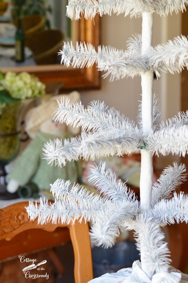 Artificial feather tree spray painted white