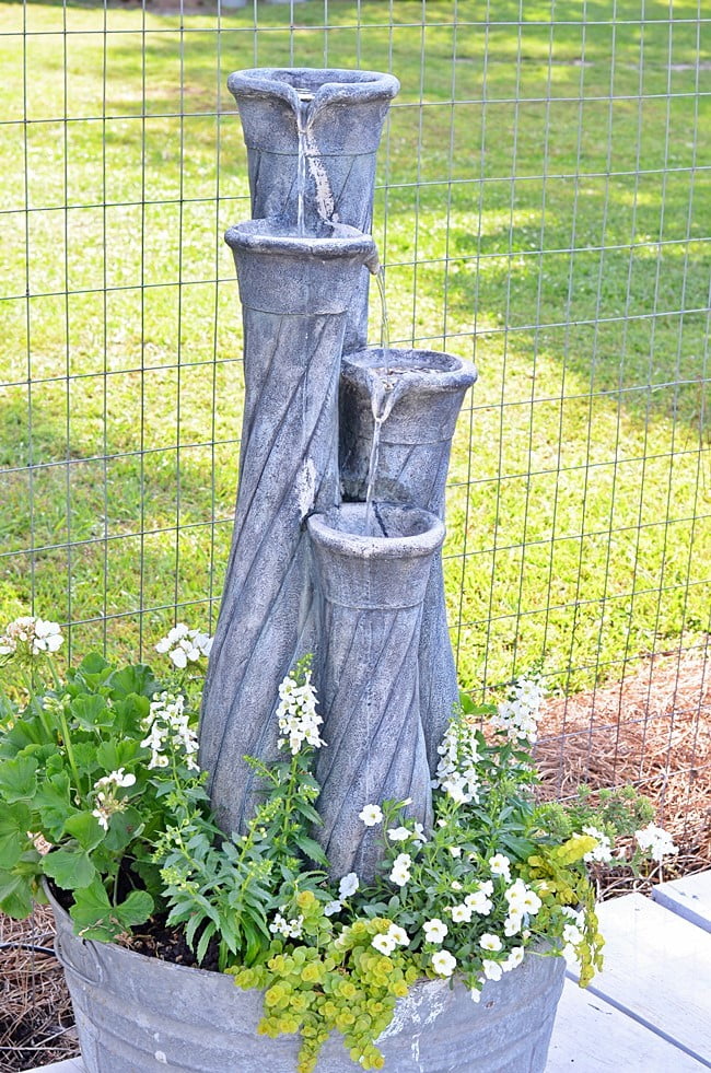 Galvanized tub fountain and planter | cottage at the crossroads