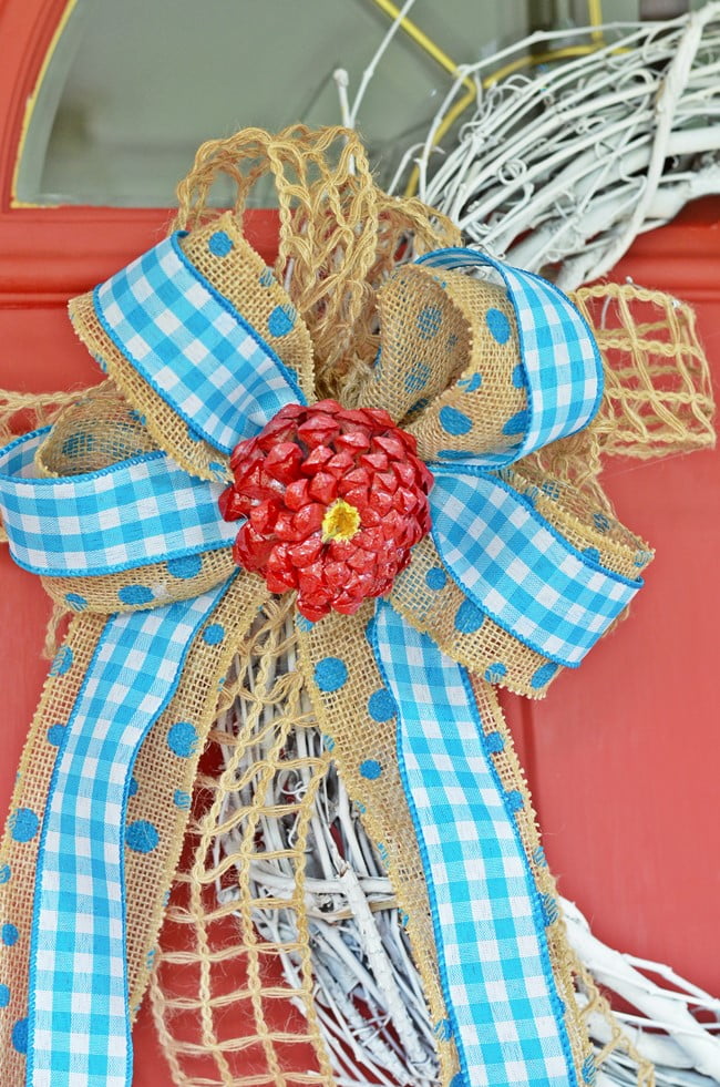 Bow on summer wreath with pine cone zinnia flower