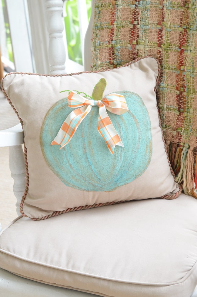 Aqua pumpkin on a fall porch