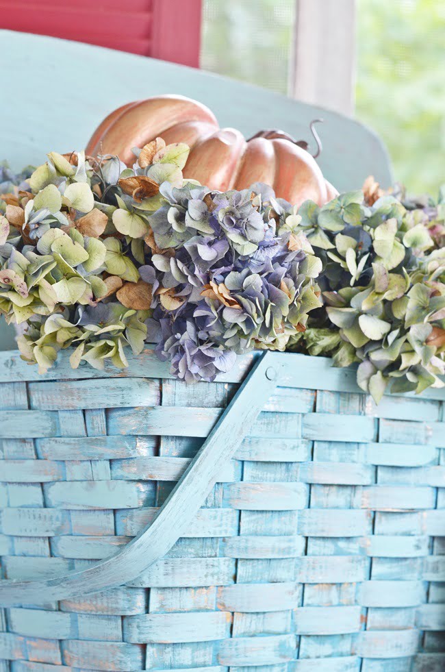 Painted picnic basket with dried hydrangeas | cottage at the crossroads