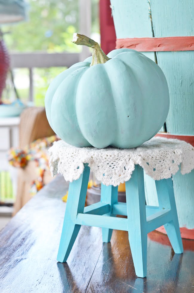 Faux pumpkin on a fall porch