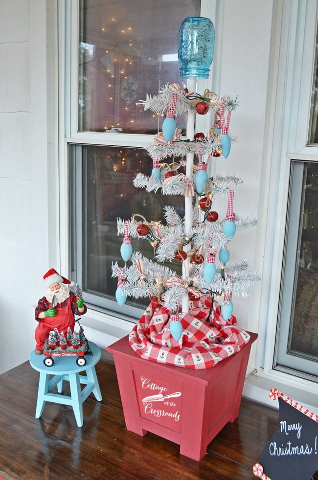 Reproduction feather tree decorated for christmas with vintage bulbs