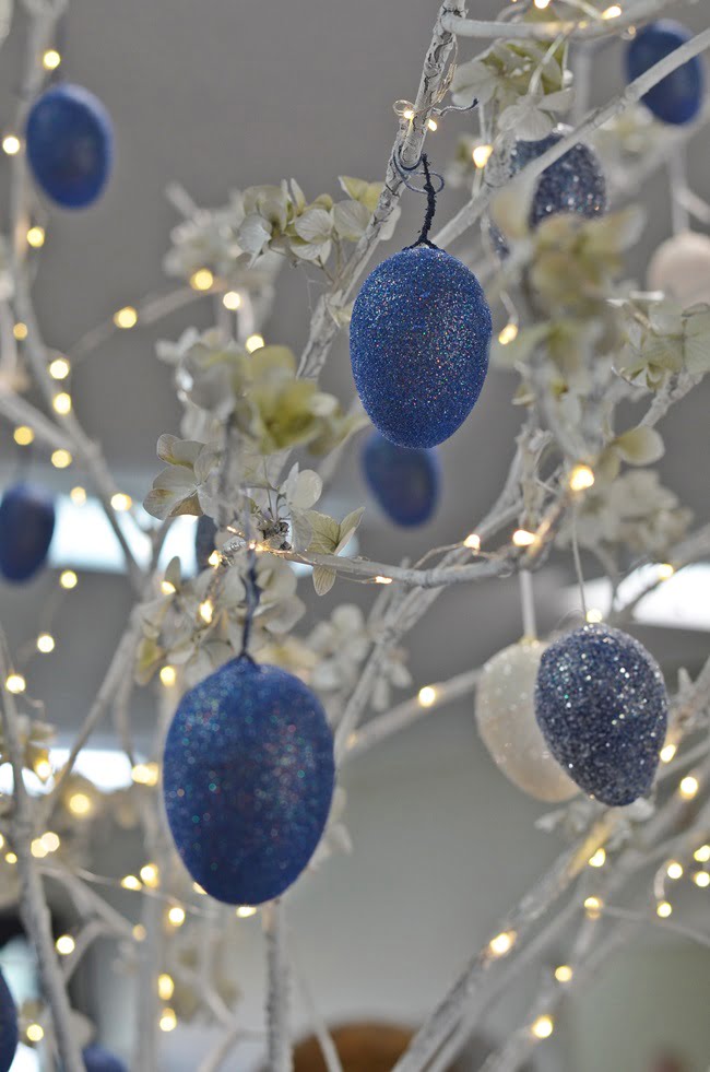 Blue easter eggs on a blue and white easter tablescape