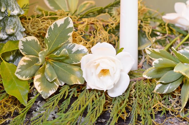 Greenery and roses used to adorn a yule log | cottage at the crossroads