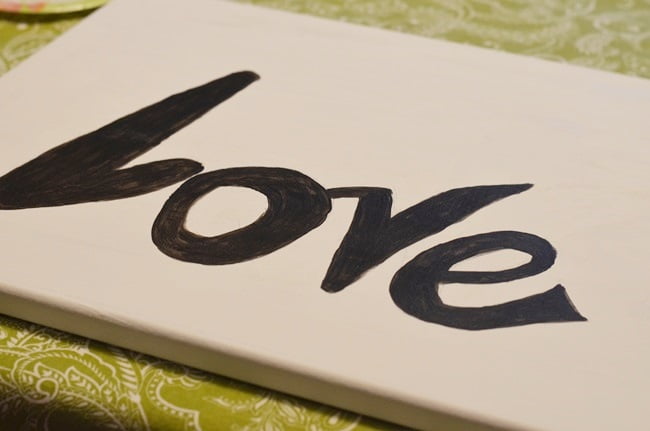 The word love painted on a canvas