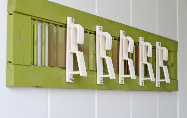 Terracotta pot holders attached to an old shutter | cottage at the crossroads