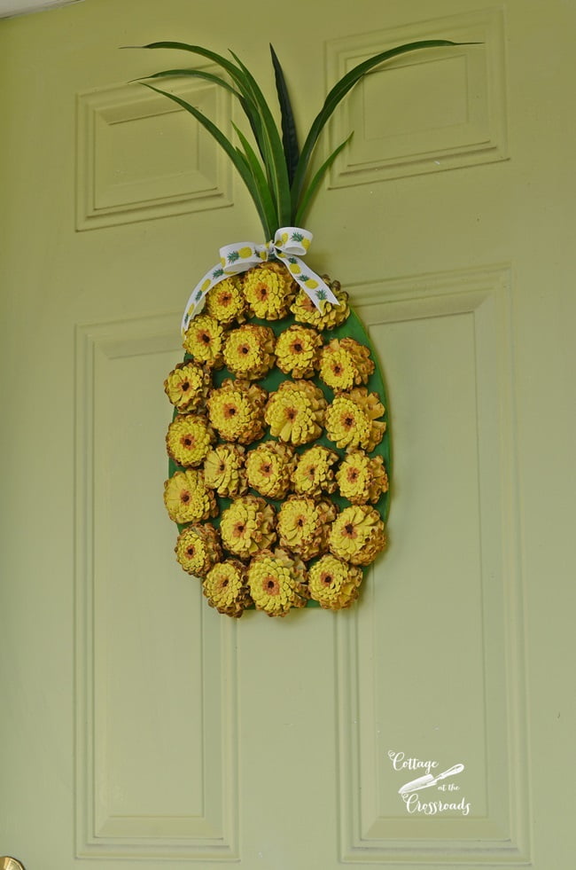 So easy to create this painted pine cone pineapple wreath!