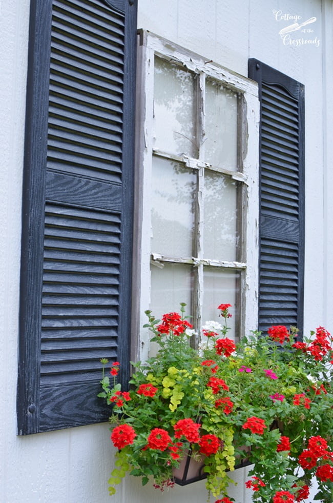 Window box underneath a fake window on a building