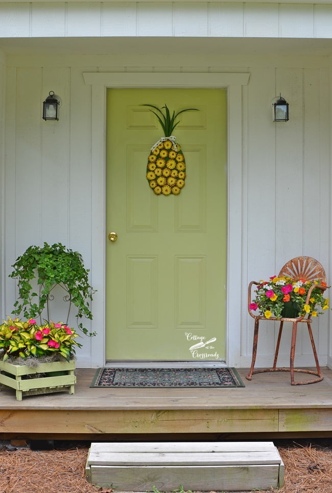A painted pine cone pineapple wreath