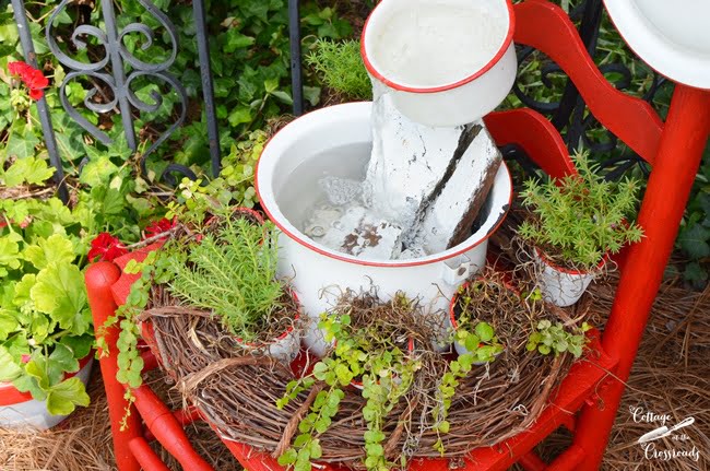 Enamelware chair fountain from cottage at the crossroads