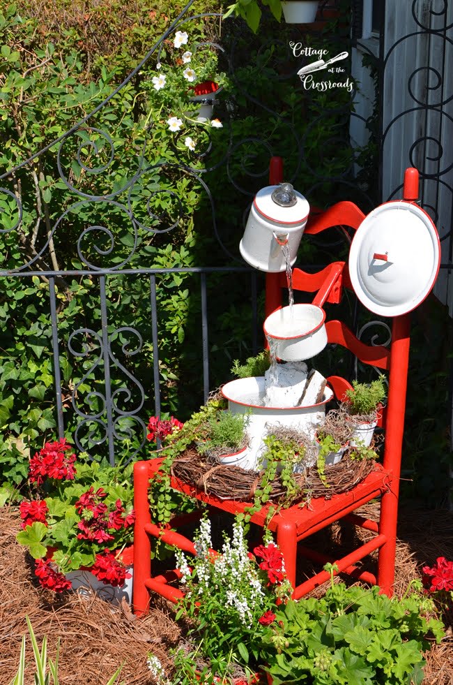 Vintage red and white enamelware chair fountain